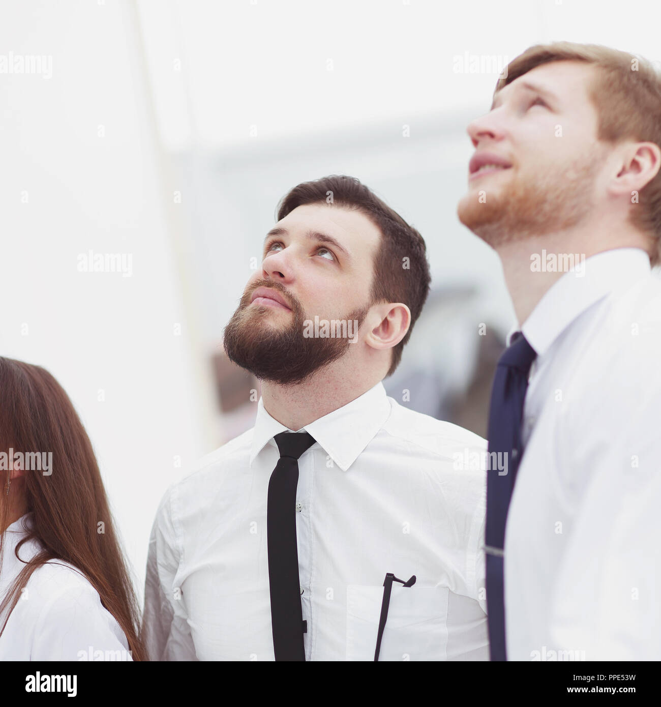 close up.a group of business people look up at a copy of the space Stock Photo