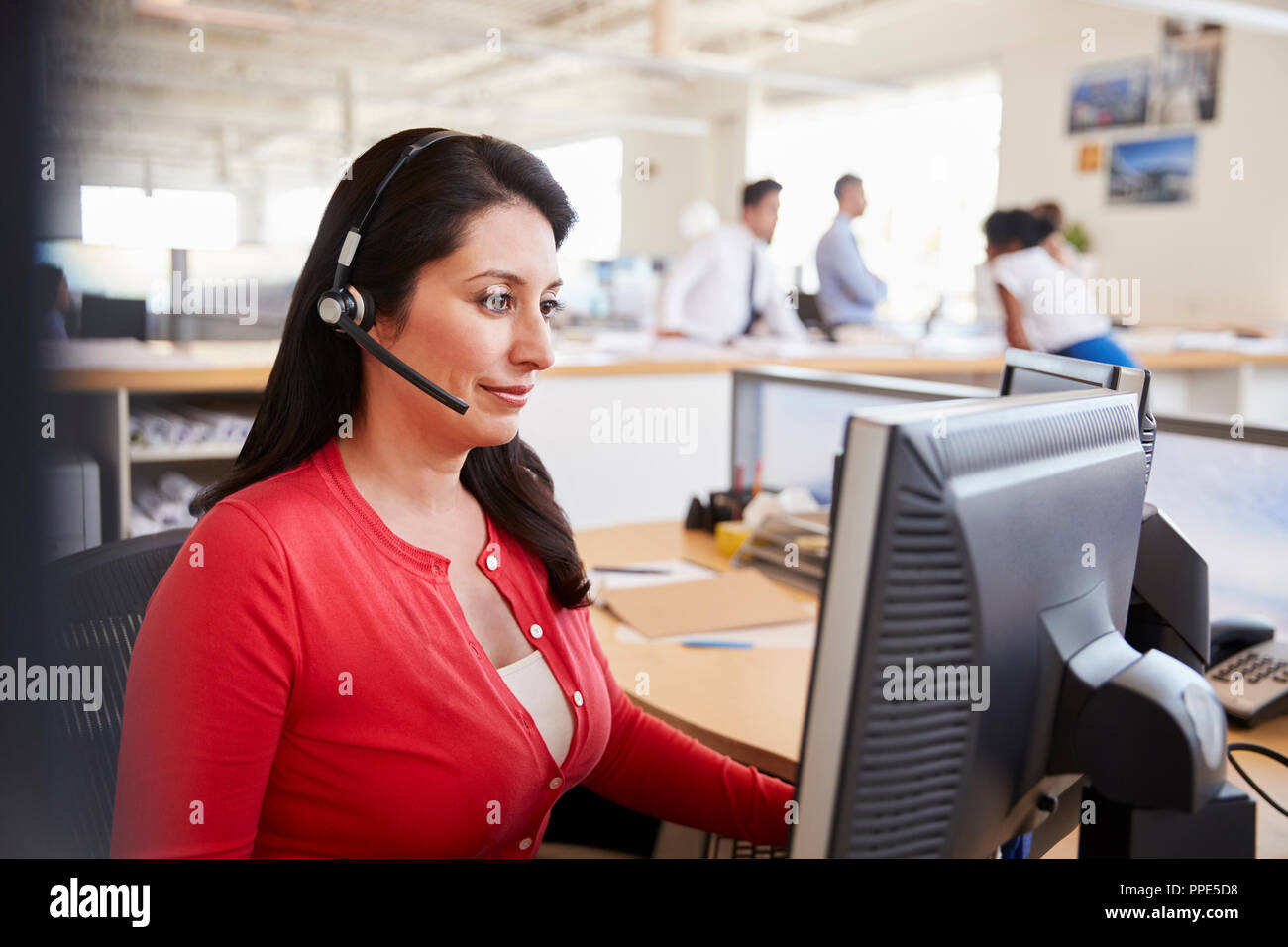 Hispanic woman working in a call centre Stock Photo