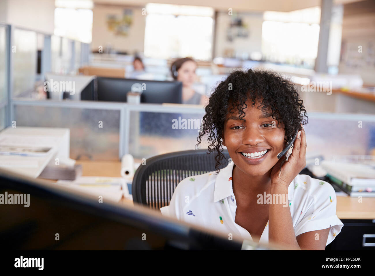 Young black woman working in a call centre Stock Photo