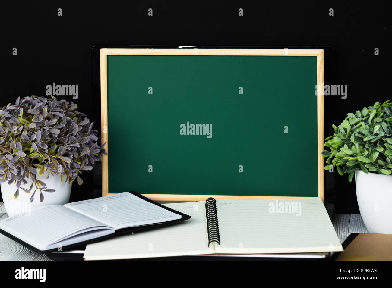 Back to school and education concept idea, green chalkboard with pile ...