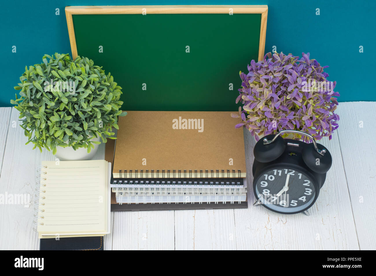 Back to school and education concept idea, green chalkboard with pile ...
