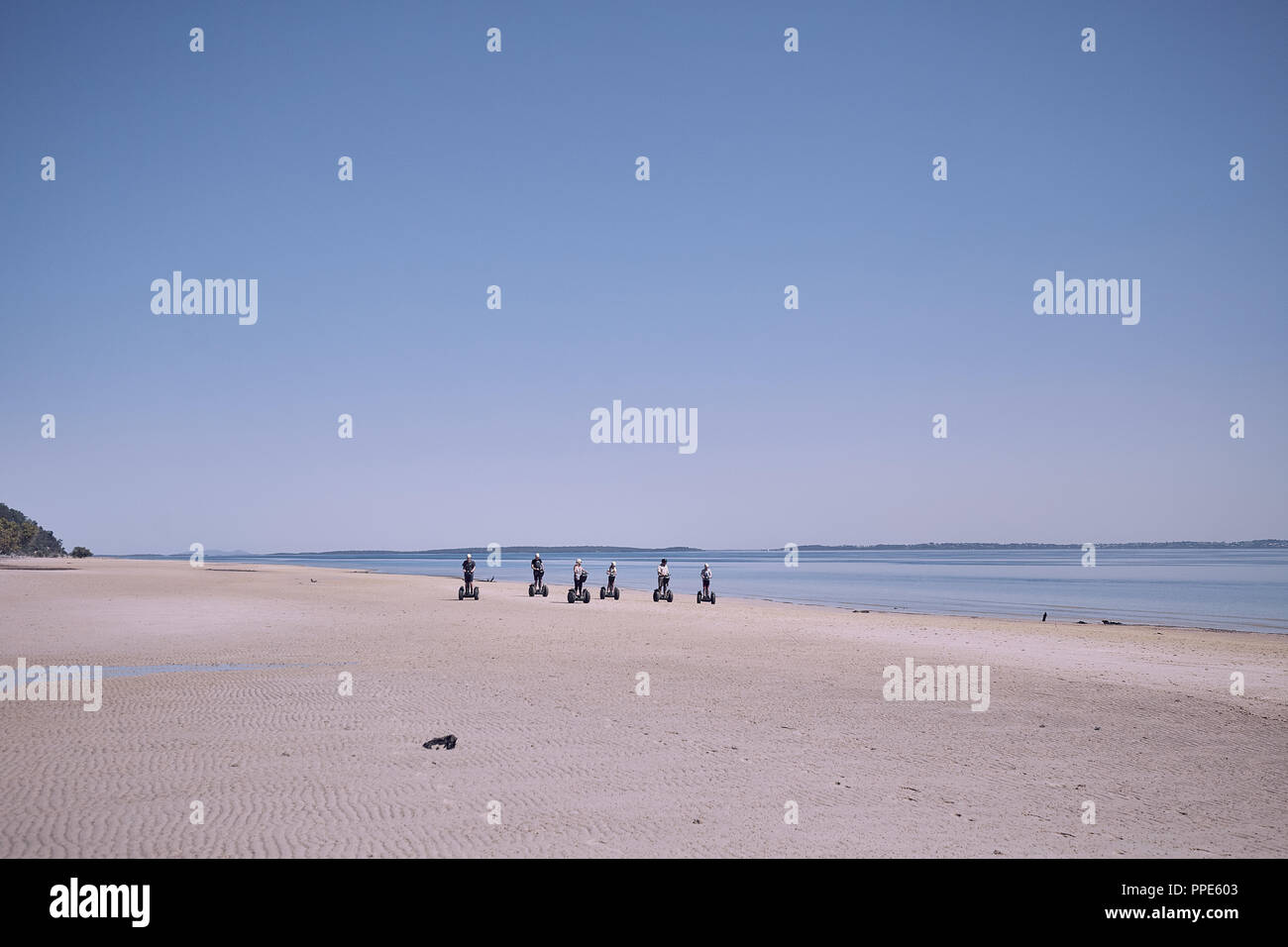 Segway users on the beach at Fraser Island, Queensland, Australia Stock Photo