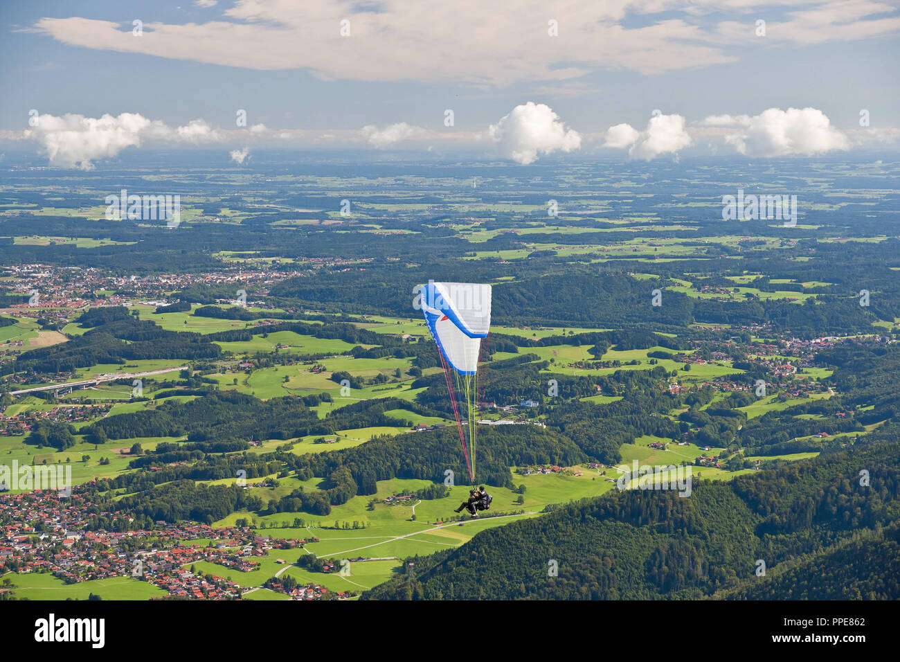 Panorama from Hochfelln with paragliders, Bergen, Chiemgau, Upper Bavaria, Bavaria Stock Photo