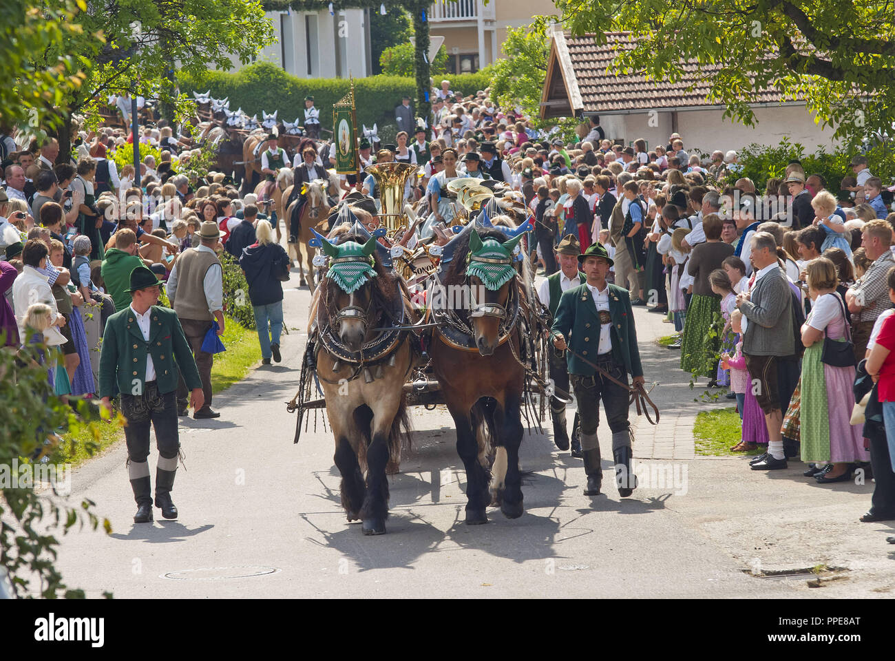 Riders on traditionally adorned horses at the Leonhardiritt (St. Leonard's Ride) in Holzhausen - Teisendorf, Upper Bavaria. The procession where the beautifully decorated horses are blessed was first mentioned in 1612. Stock Photo
