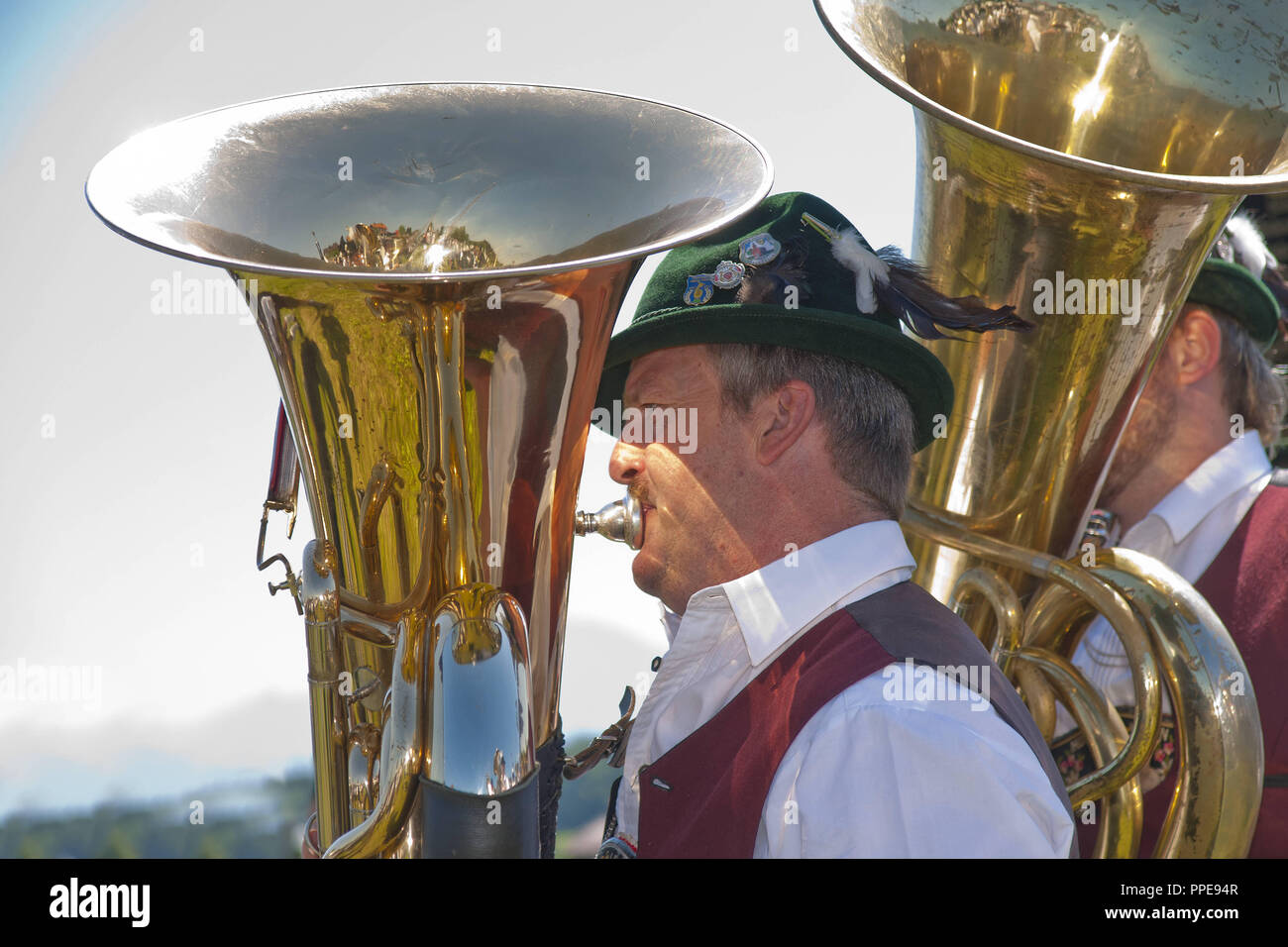 The bass players of the brass band of Thundorf during a pageant, Berchtesgadener Land/Rupertiwinkel, Upper Bavaria. Stock Photo