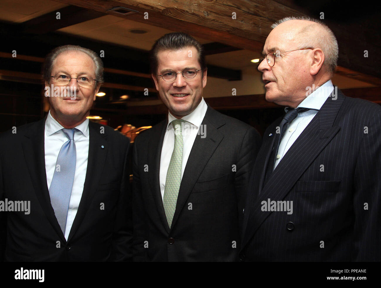 From left to right: Wolfgang Reitzle, CEO of The Linde Group, Defense Minister Karl Theodor zu Guttenberg and host Wolfgang Seybold at the German-American Friendship Dinner in Kaefer Restaurant in Bogenhausen during the Munich Security Conference. Stock Photo