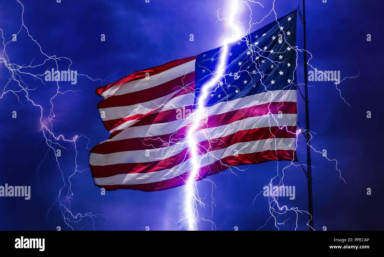 A flash of lightning seems to split an American flag into two parts. | usage worldwide Stock Photo