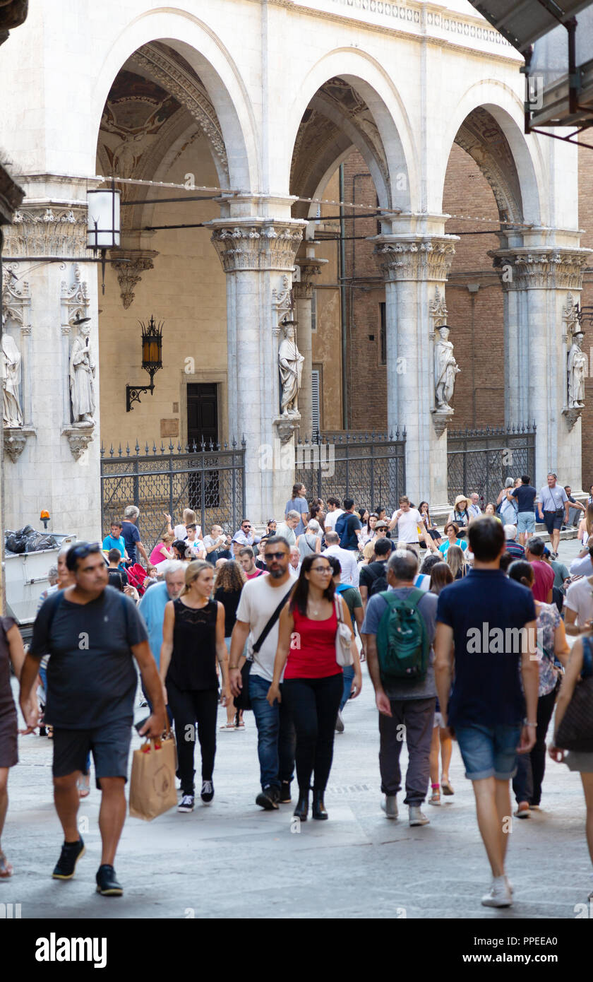 Italian People Walking In The Narrow Streets Of Medieval Siena Siena Tuscany Italy Europe Stock Photo Alamy