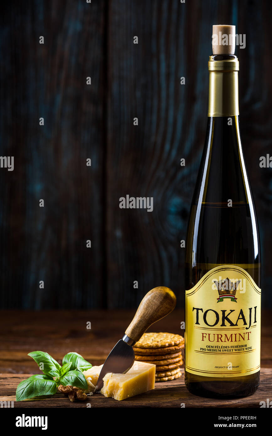 TARNOW, POLAND - SEPTEMBER 24, 2018: Bottle of hungarian white wine Tokaji Furmint, serving suggestion. Stock Photo