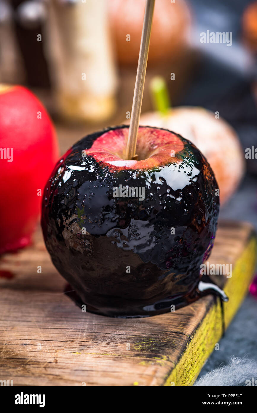 Black candy apple,Halloween food. Stock Photo