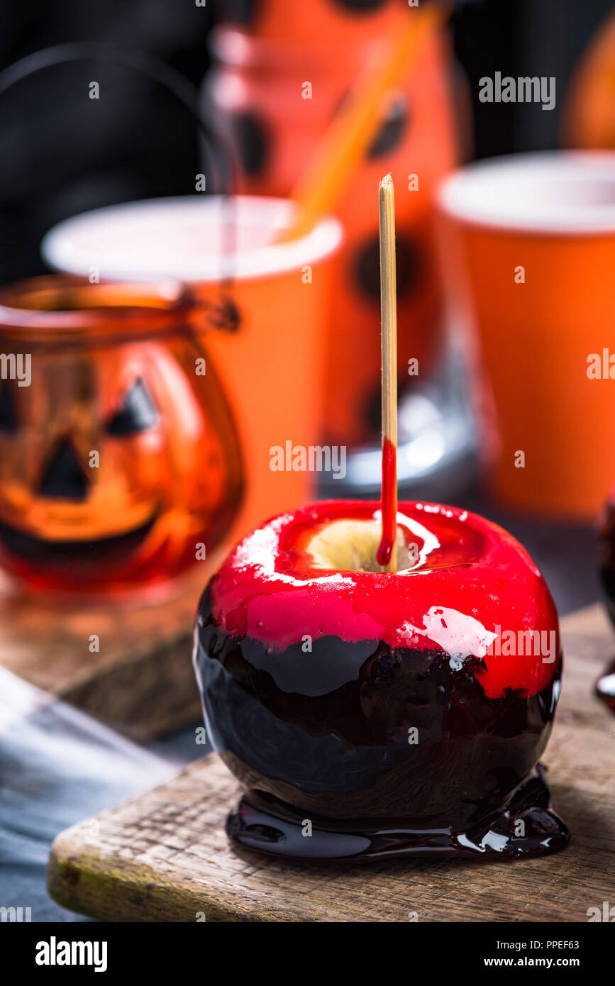 Red candy apple, Halloween food. Stock Photo