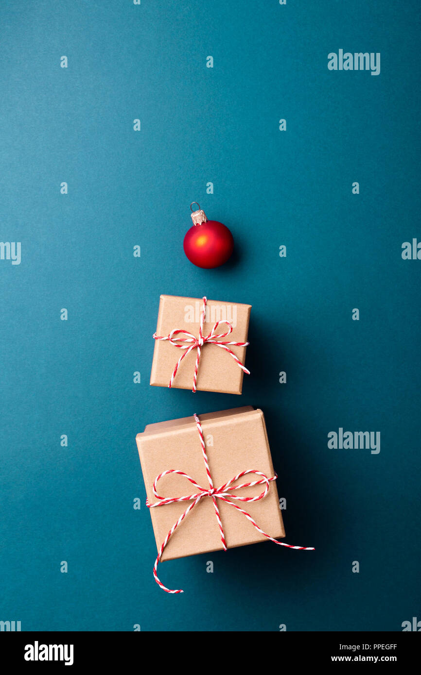 Gift boxes wrapped in kraft paper and tied with candy cane Christmas ...