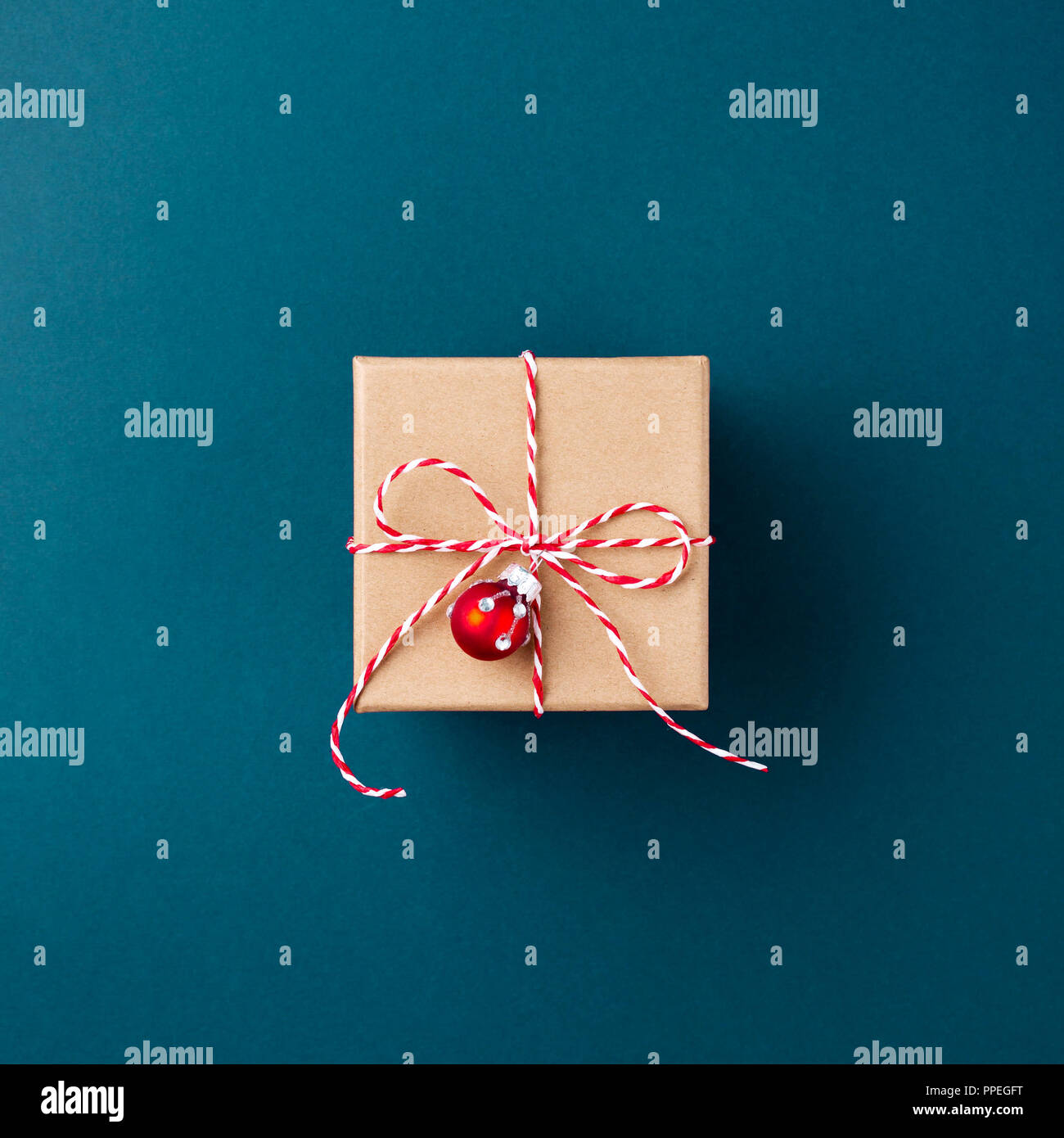 Gift boxe wrapped in kraft paper tied with candy cane Christmas rope on ...