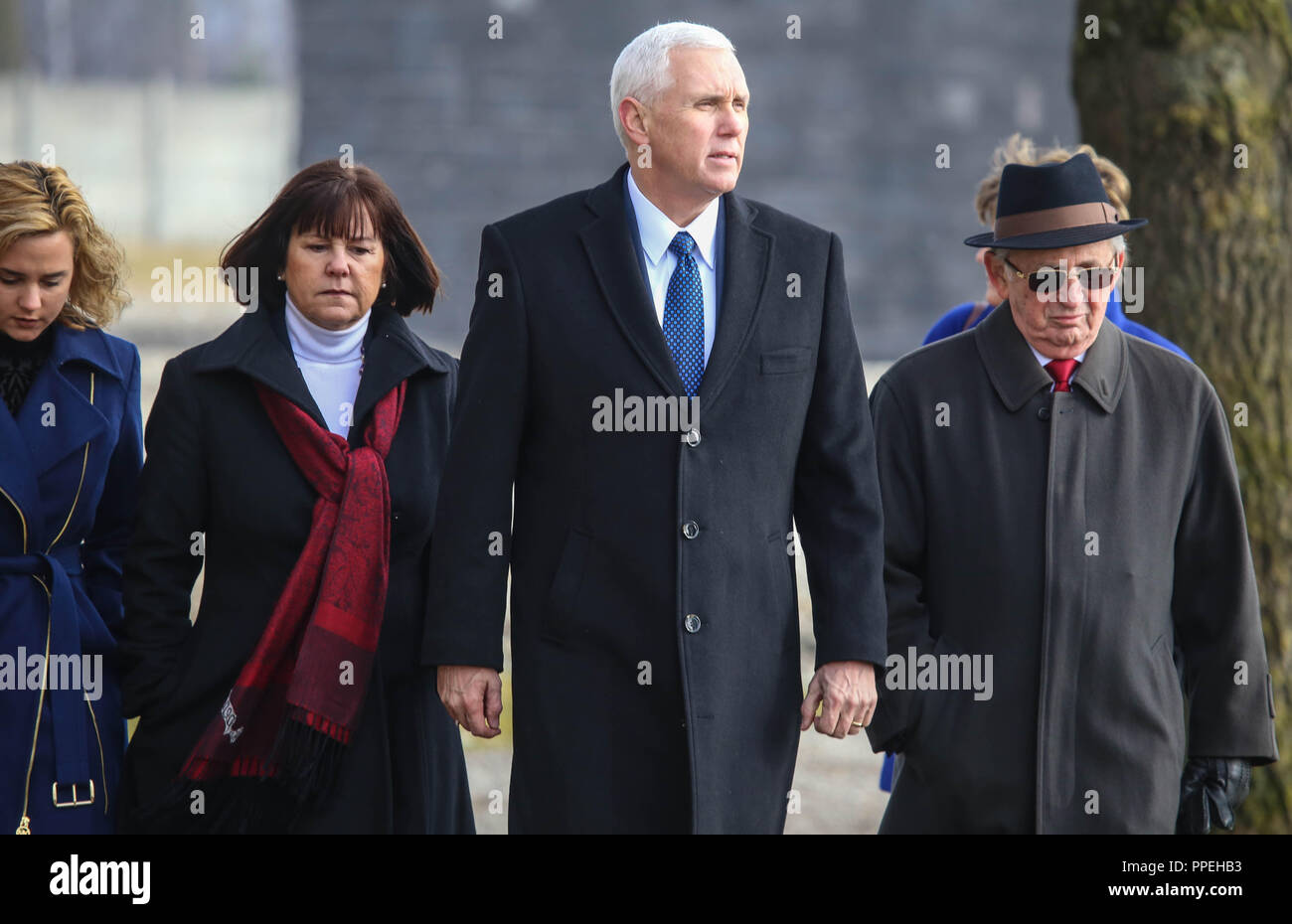 The American Vice President Mike Pence (2nd from right) with his wife Karen and daughter Charlotte on a visit to the Dachau Concentration Camp Memorial Site. At right, contemporary witness Abba Naor. Stock Photo