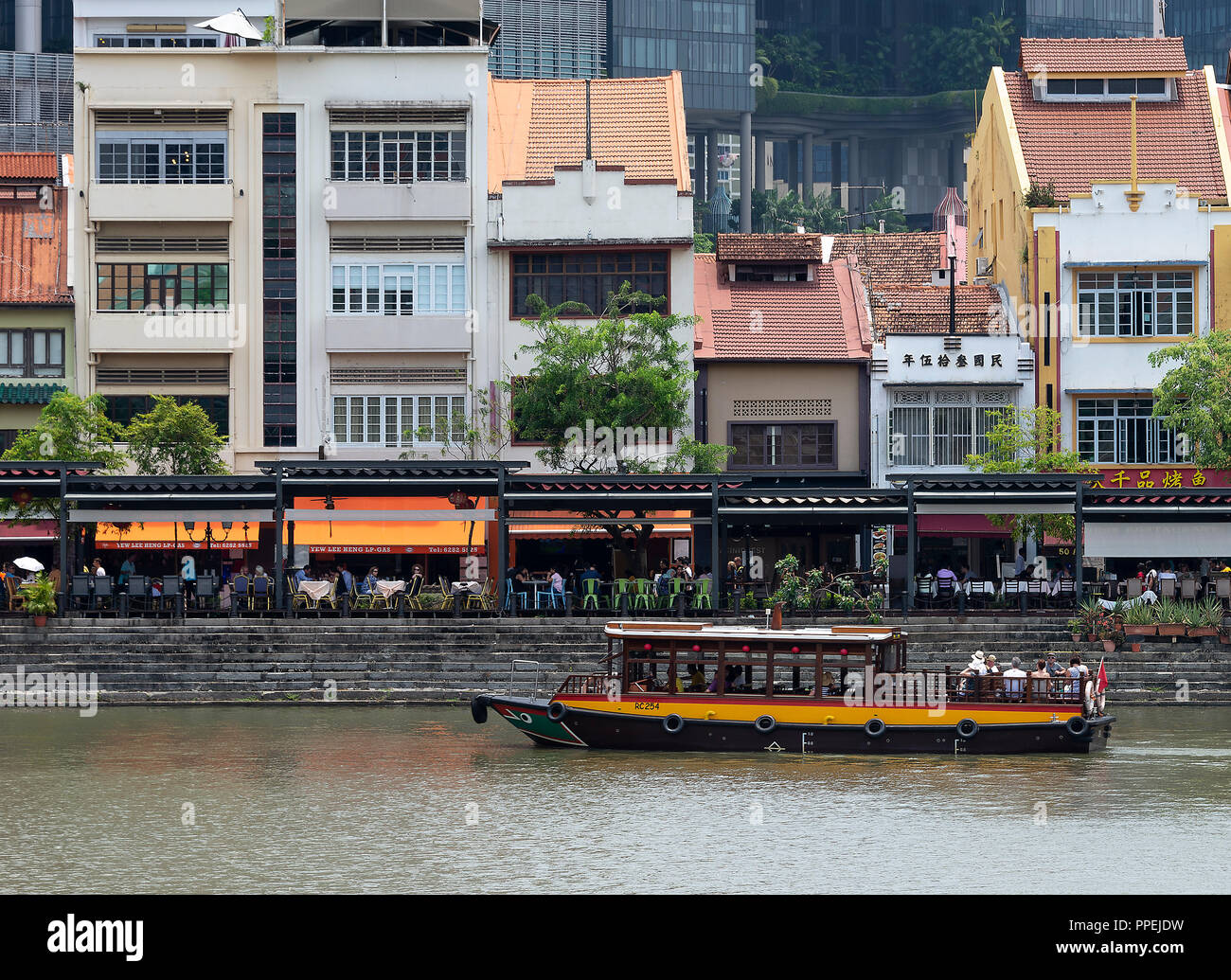 The Beautiful Boat Quay Housing Restaurants with Passenger Taxi Boat on Singapore River South