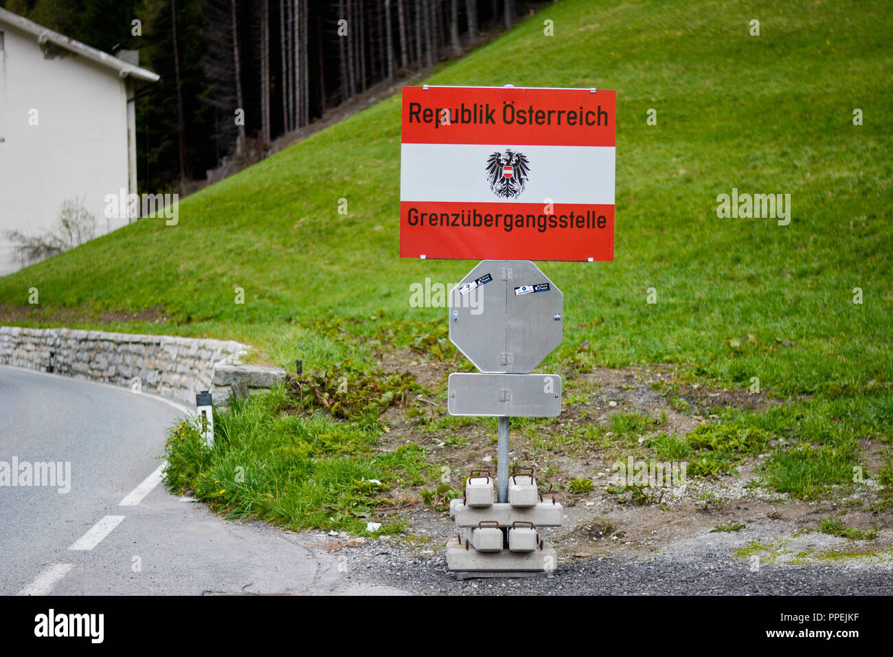 On the Brenner Pass, the border between Austria and Italy, there is a sign with the words 'Republic of Austria - border crossing point.' Stock Photo