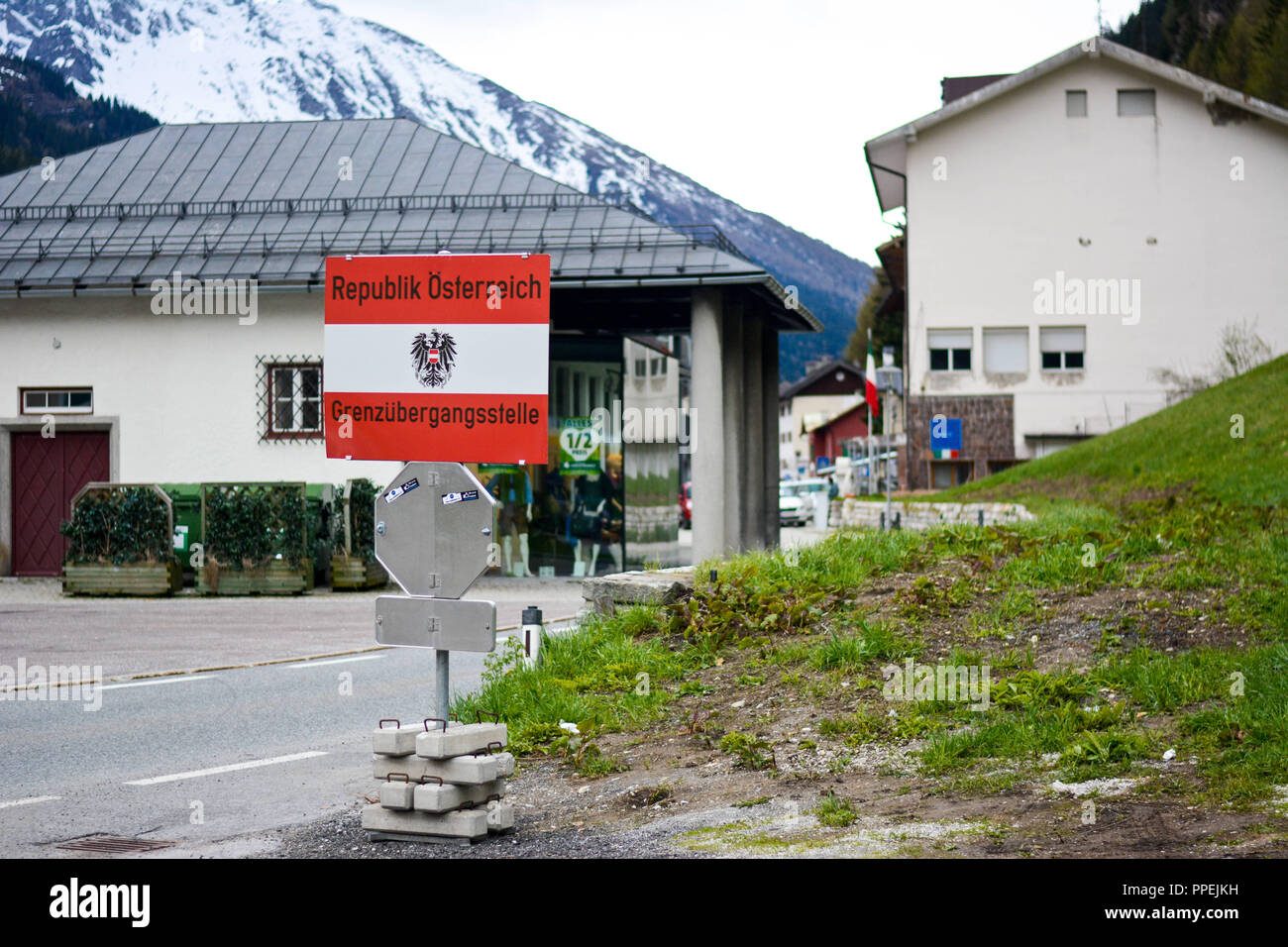 On the Brenner Pass, the border between Austria and Italy, there is a sign with the words 'Republic of Austria - border crossing point.' Stock Photo