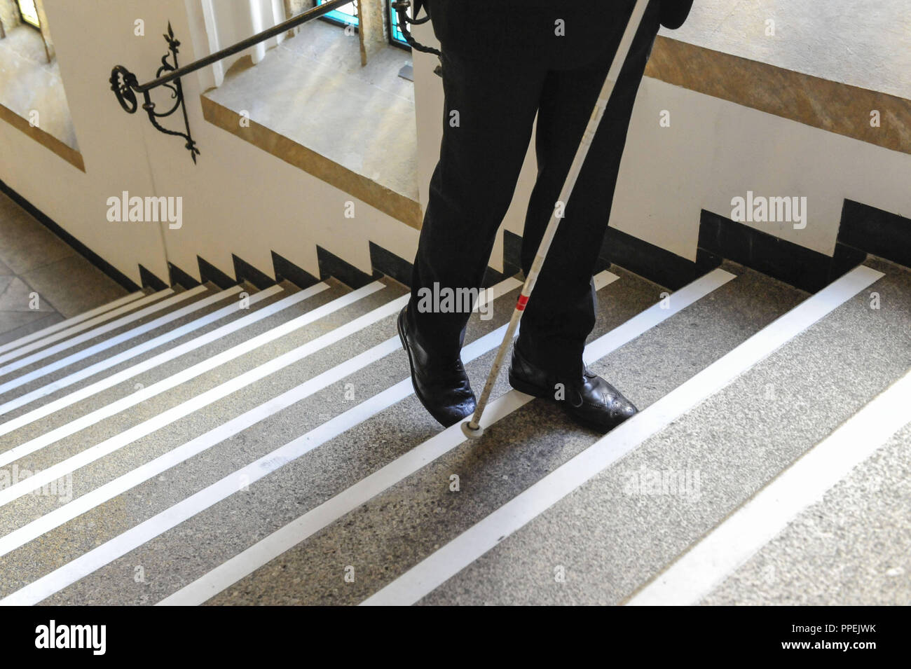 On the occasion of the nationwide Day of Visually Impaired People, the Bavarian Blind and Visually Impaired Association (Bayerischer Blinden- und Sehbehindertenbund e.V. - BBSB) won the cooperation of the City of Munich and the Munich Stadtmuseum fo the action 'Contrasting stair markings make staircases safer'. For this occasion, the staircase in the Town Hall is provided with a marking strip on every step, a better illumination and braille on the handrail. Stock Photo