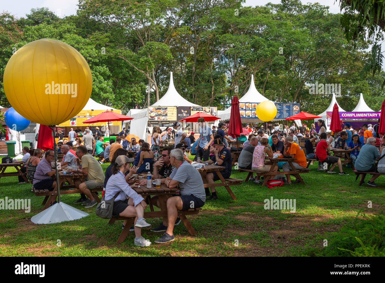 Busy Dockside Hawker Market Stalls Selling Food and Drinks to Formula
