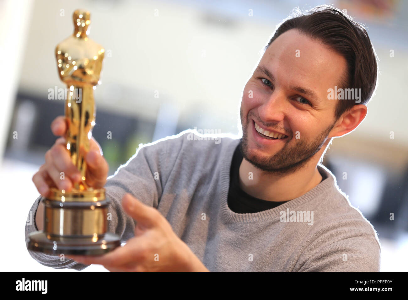 Animator Alexandre Espigares shows his Oscar, which he has received for Best Animated Short Film, at the film company Arri in the attic of a backyard in Schwabing. Stock Photo