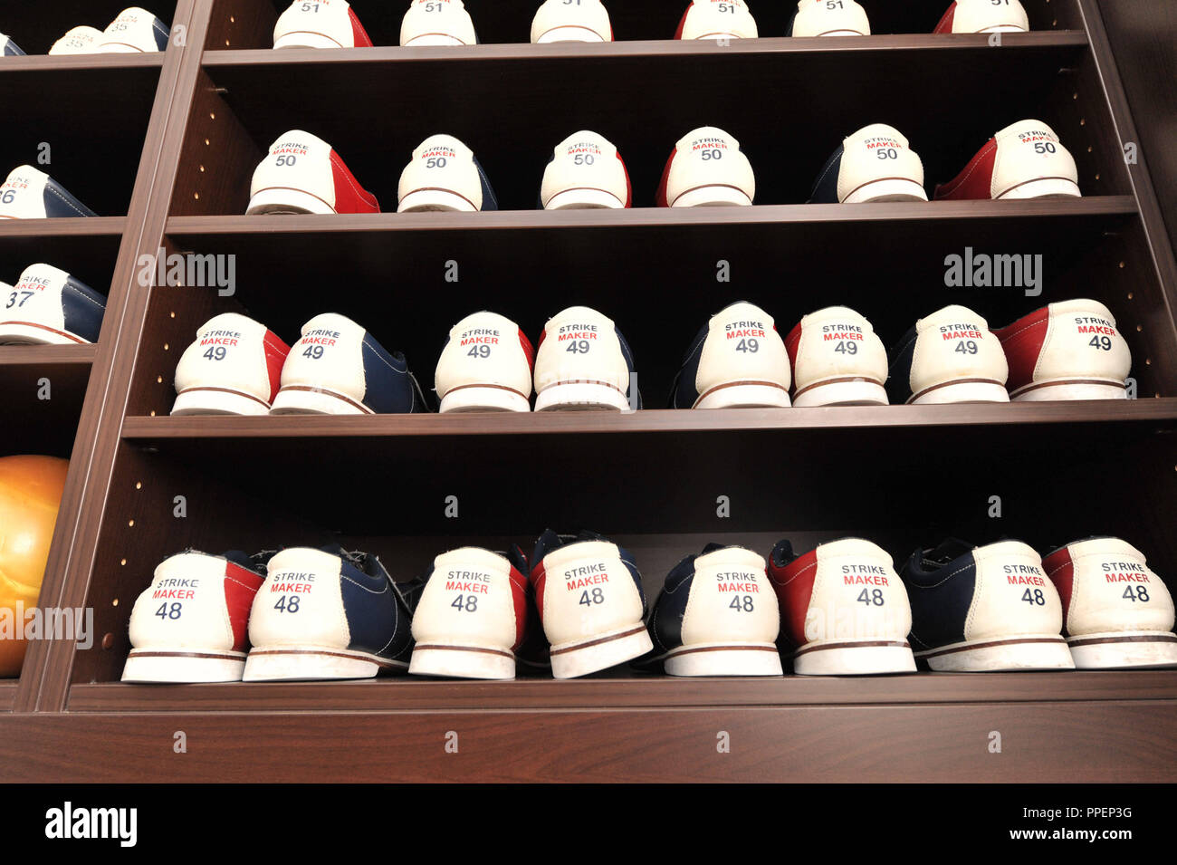 Shelf with bowling shoes in the bowling center 'DreamBowlPalace' in