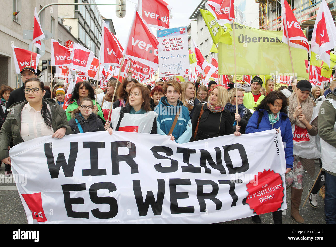 Collective bargaining 2014: More than 2,000 employees from the public sector participate in a warning strike in the Schwanthalerstrasse in Munich and demand in a demonstration a wage increase of 100 euros plus 3.5%, a leave entitlement of 30 days and working time regulations. Since many child care workers took part in the demonstration half of all municipal day care centers remained closed. Stock Photo