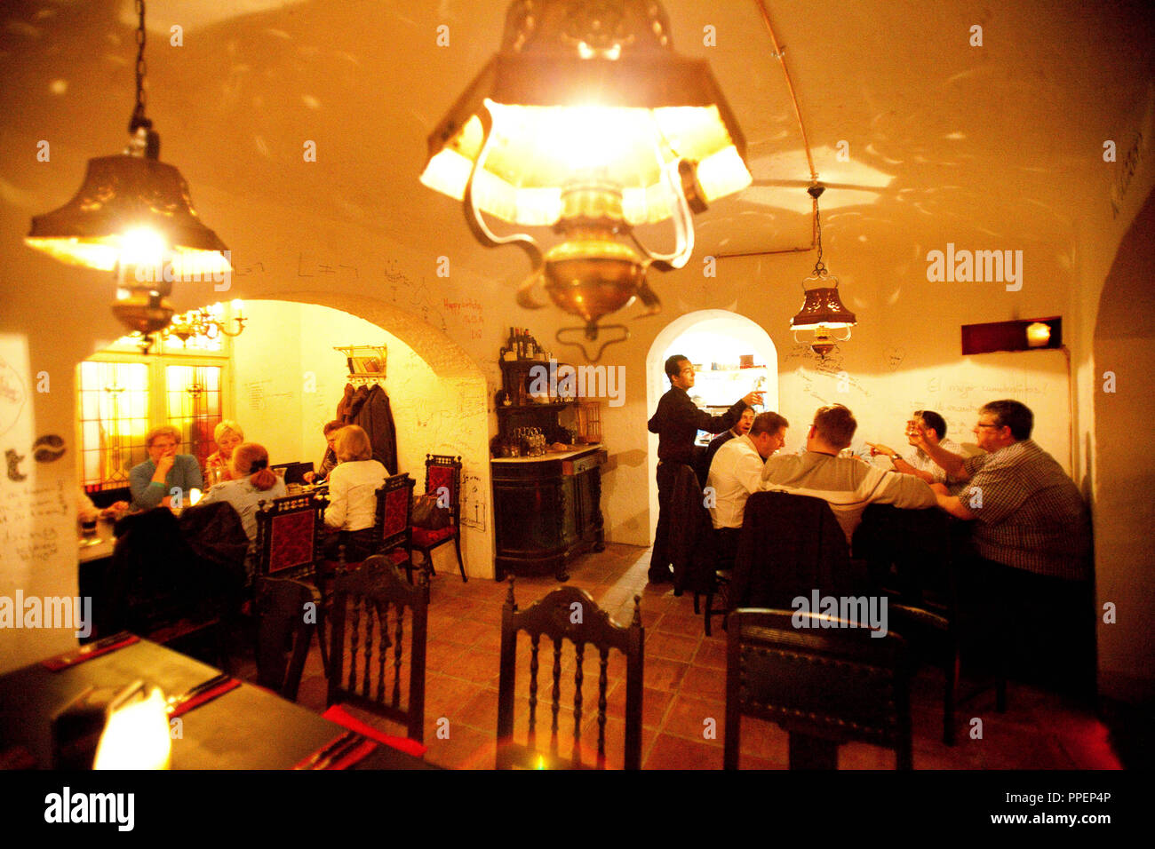 Guests in the Spanish restaurant 'Don Quijote' in the basement of a listed building in the Biedersteiner Strasse 6. Stock Photo