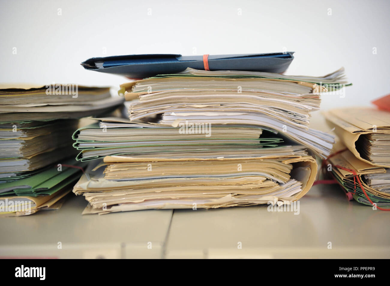 Stack of files at the Office for Housing and Migration in the Franziskanerstraße 8, Munich, Germany Stock Photo