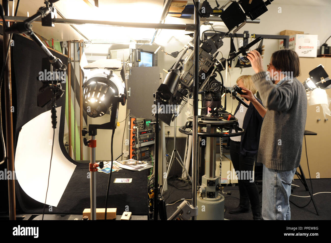 Camera specialist Thomas Schmidt is the animation studio of the Bayerischer Rundfunk (BR) in Freimann. Objects and images placed so in scene that they appear dynamic and three-dimensional. Stock Photo