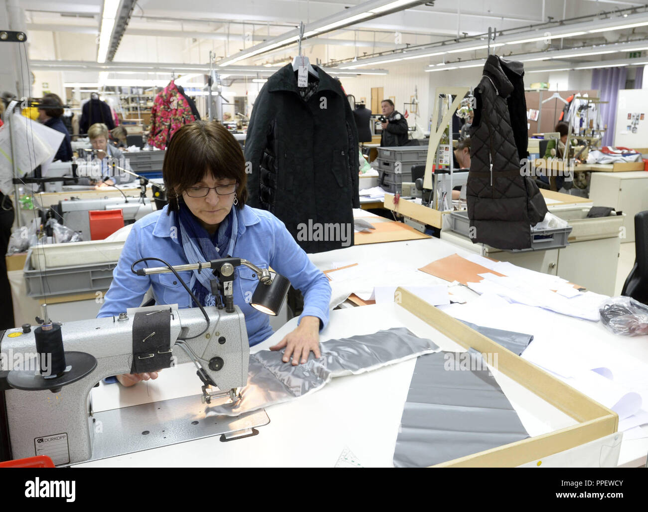 Seamstresses in a sewing room at the headquarters of Willy Bogner GmbH & Co.  KGaA in the Sankt Veit-Strasse in Berg am Laim Stock Photo - Alamy