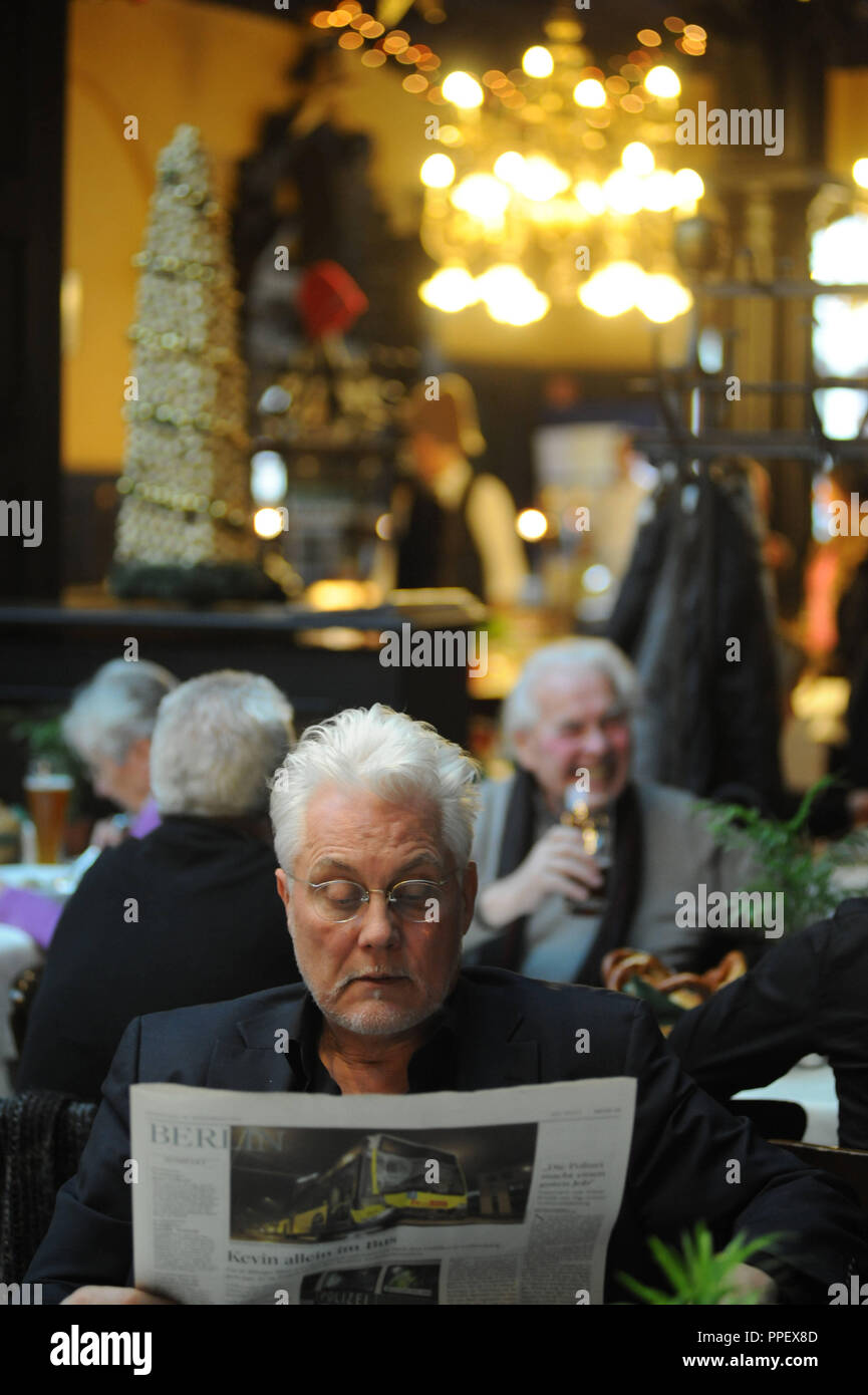 Newspaper reader in the Augustiner restaurant in Neuhauser Strasse in Munich. Stock Photo