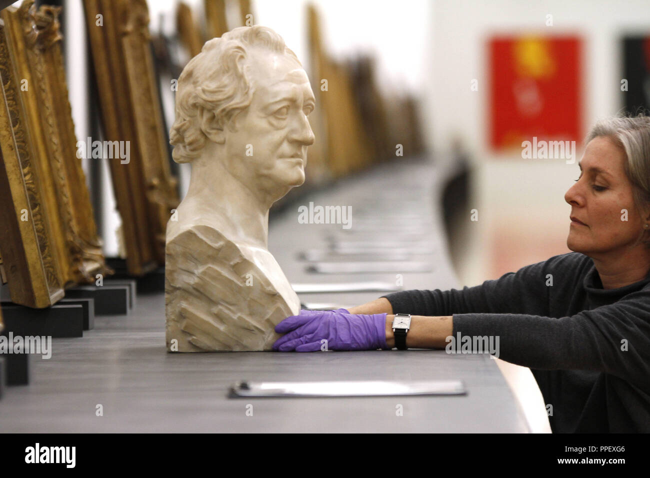 Employee making final preparations for the exhibition 