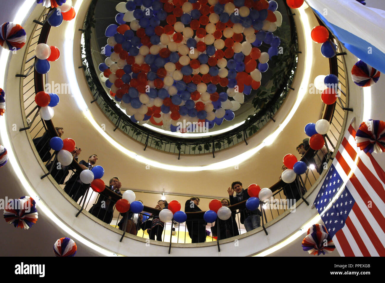 U.S. Election Night 2012 in Munich: Party in the night of the U.S. presidential election in the Amerika-Haus on Karolinenplatz. In the picture, guests in the rotunda that is decorated with red, white and blue balloons. Stock Photo