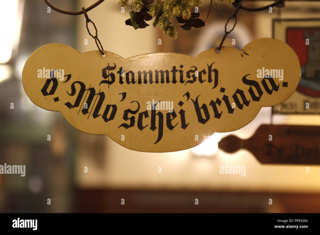 Stammtisch sign of the regulars' table 'd.Mo'schei briada' at the Hofbraeuhaus. Stock Photo