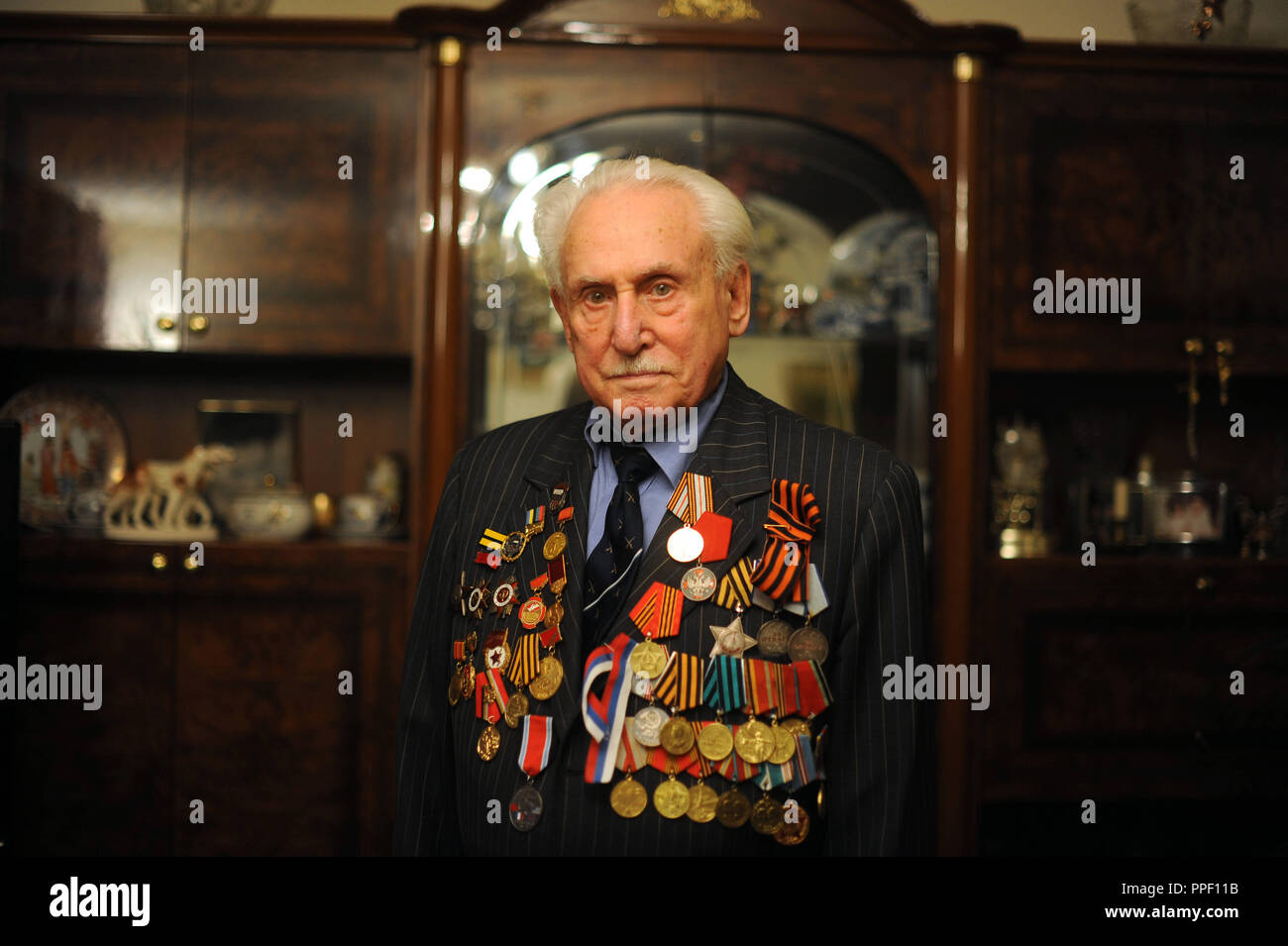 David Dushmann, a 91-year-old Russian Jew living in Munich, who in 1945 liberated the Auschwitz concentration camp with a tank of the Red Army. Later, he successfully worked as a fencer and over 30 years as a fencing nationalist of the Soviet Union. The picture shows him with his military and sports medals. Stock Photo