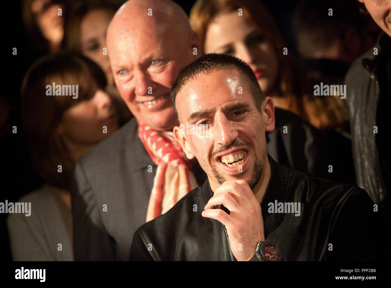 Chairman of Hublot Jean-Claude Biver (in the background) with Bayern München football player Franck Ribery at the presentation of the exclusive FC Bayern München fan clocks at the Hublot shop in Maximilian street, Munich, Germany Stock Photo
