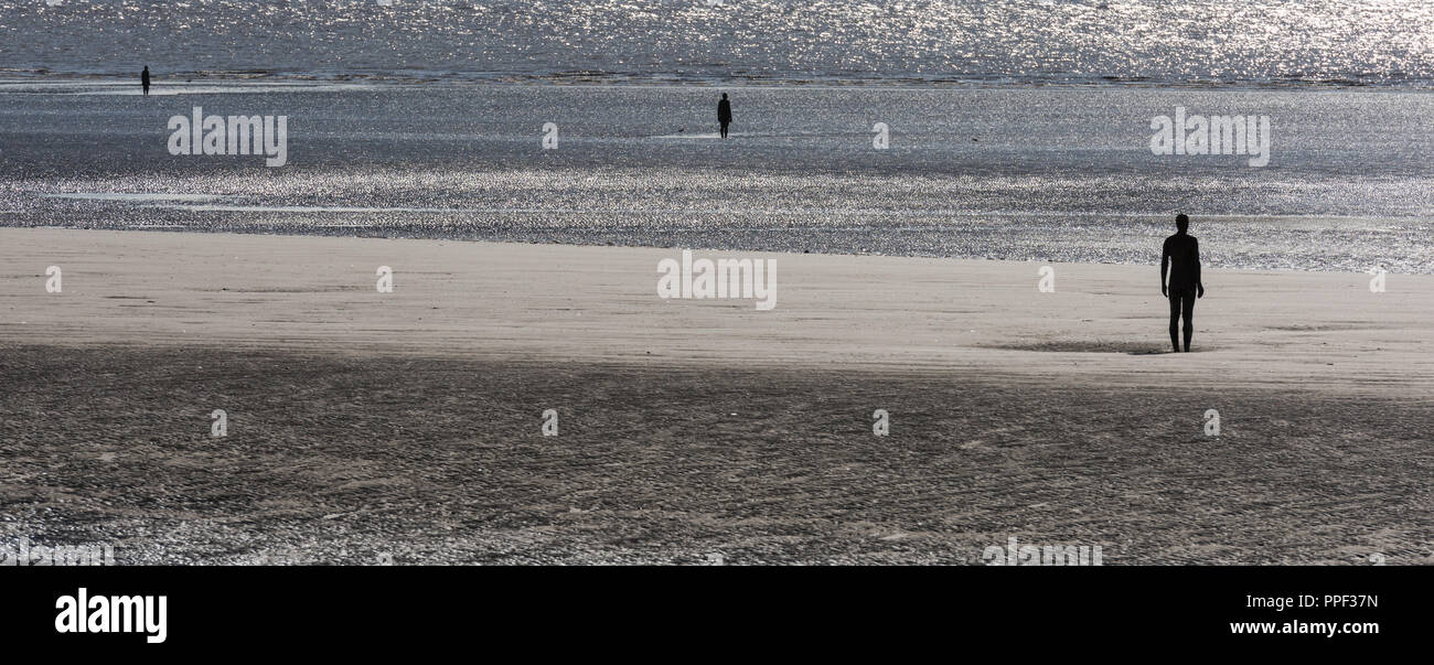 Sculptures by Antony Gormley on Crosby Beach near Liverpool, UK Stock
