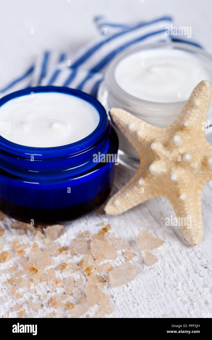 face cream in jars with sea salt and star closeup Stock Photo Alamy