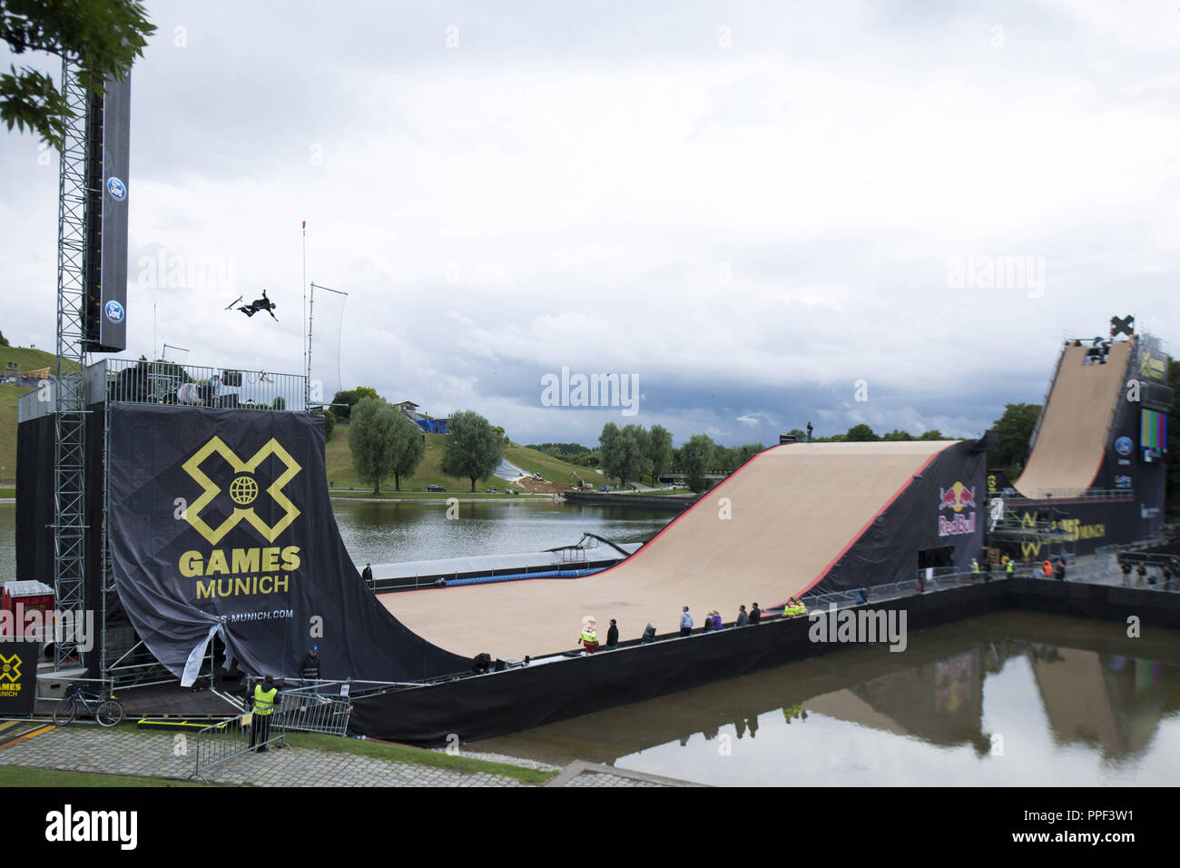 A skateboarder trains on the big ramp on the Olympic Lake for the Skateboard  Big Air Final at the X-Games Munich Stock Photo - Alamy