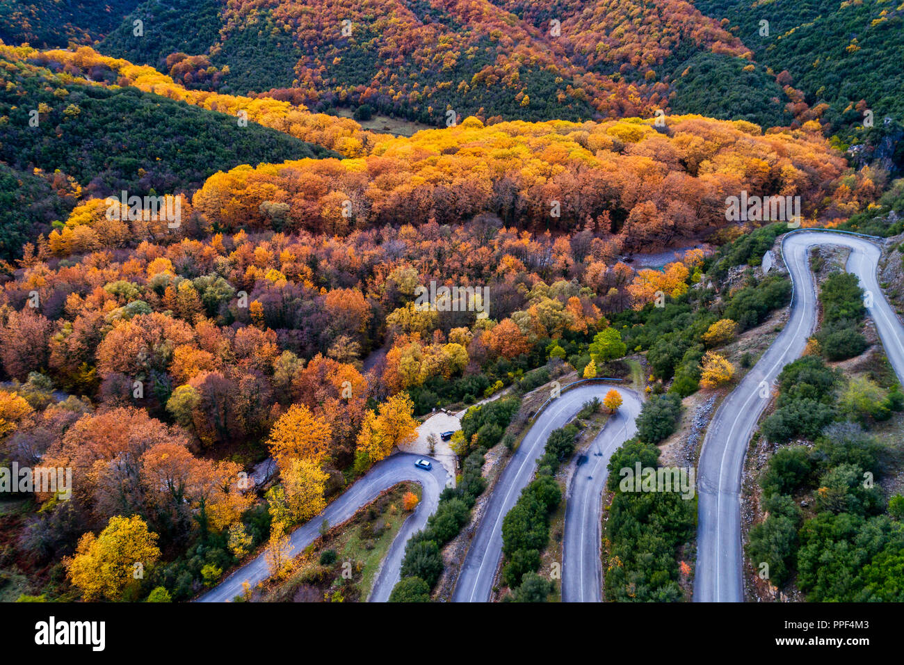 Aerial view of the the Vikos Gorge in the autumn and provincial road with many zigzag in the Epirus Zagorohoria, Greece. National park Stock Photo