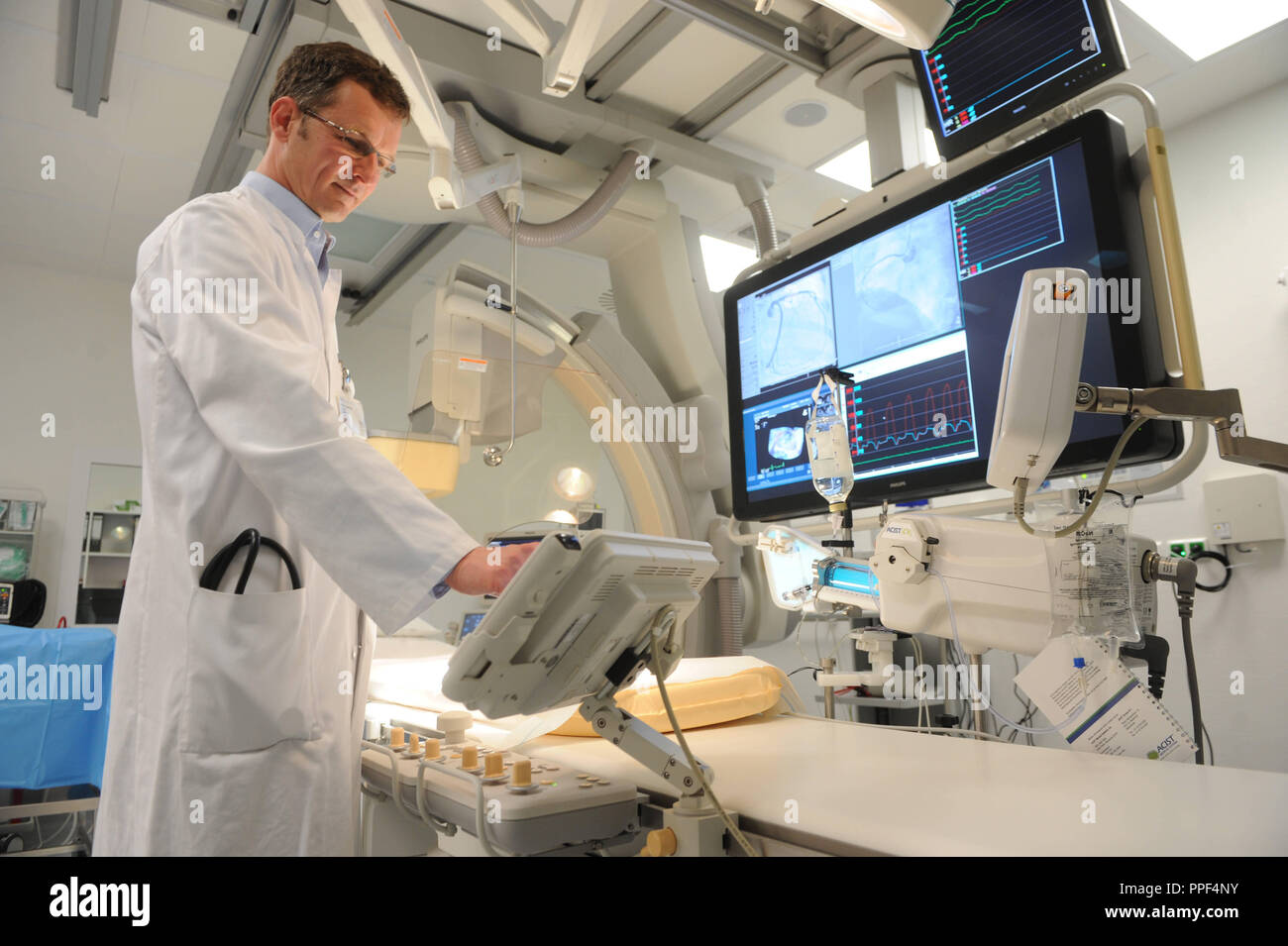 Chief physician Harald Kuehl in the new cardiac catheterization laboratory of the Harlaching Hospital. Stock Photo