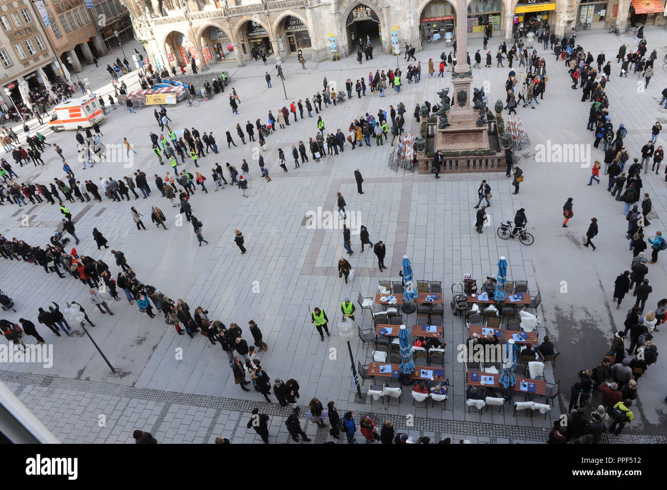 Long queue of people, on the last day, to sign the petition against tuition fees before the registration site at the Munich City Hall. Stock Photo
