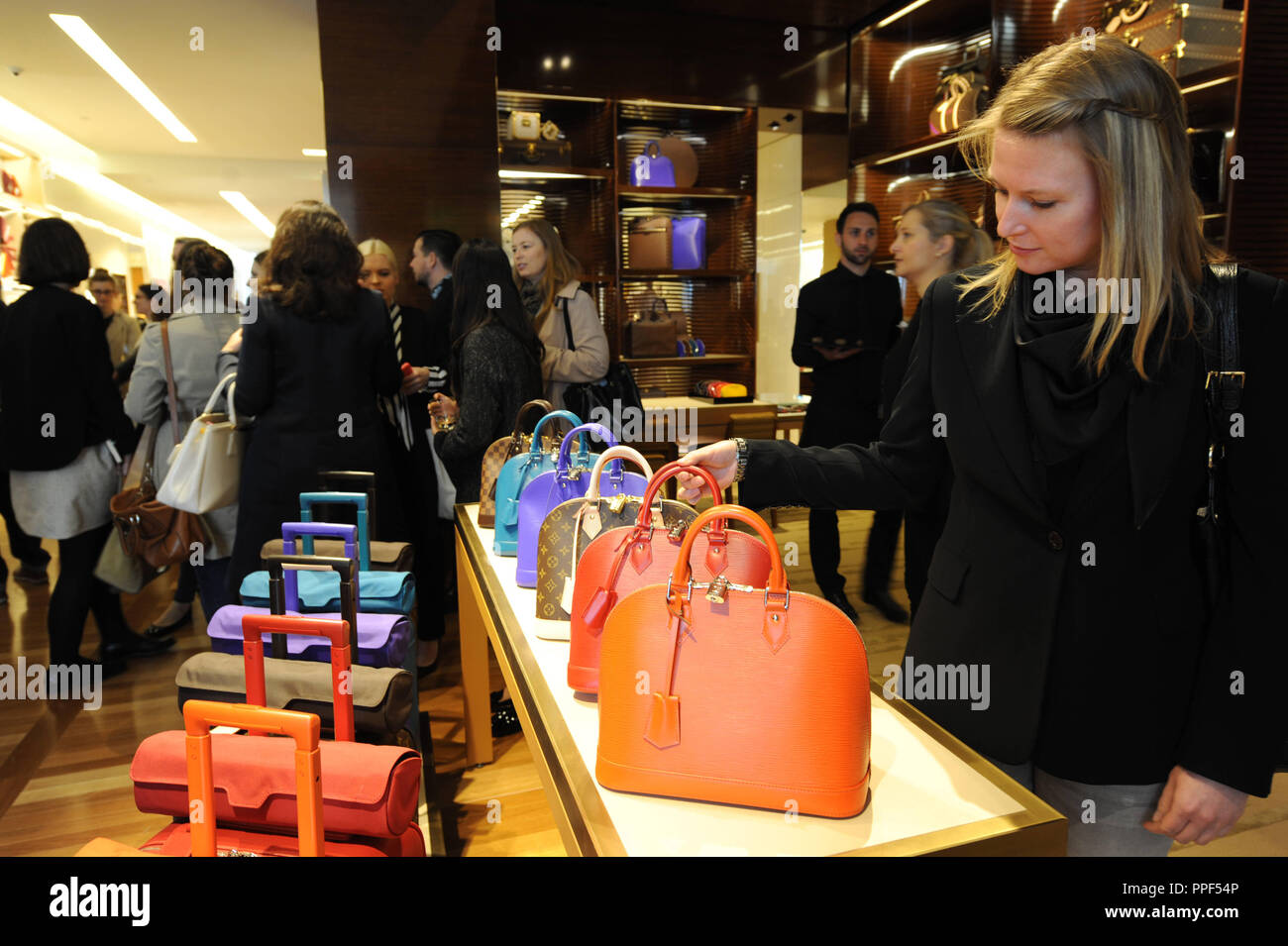 Opening of the Louis Vuitton store in the Residenzstrasse. Customers admire bags. Stock Photo