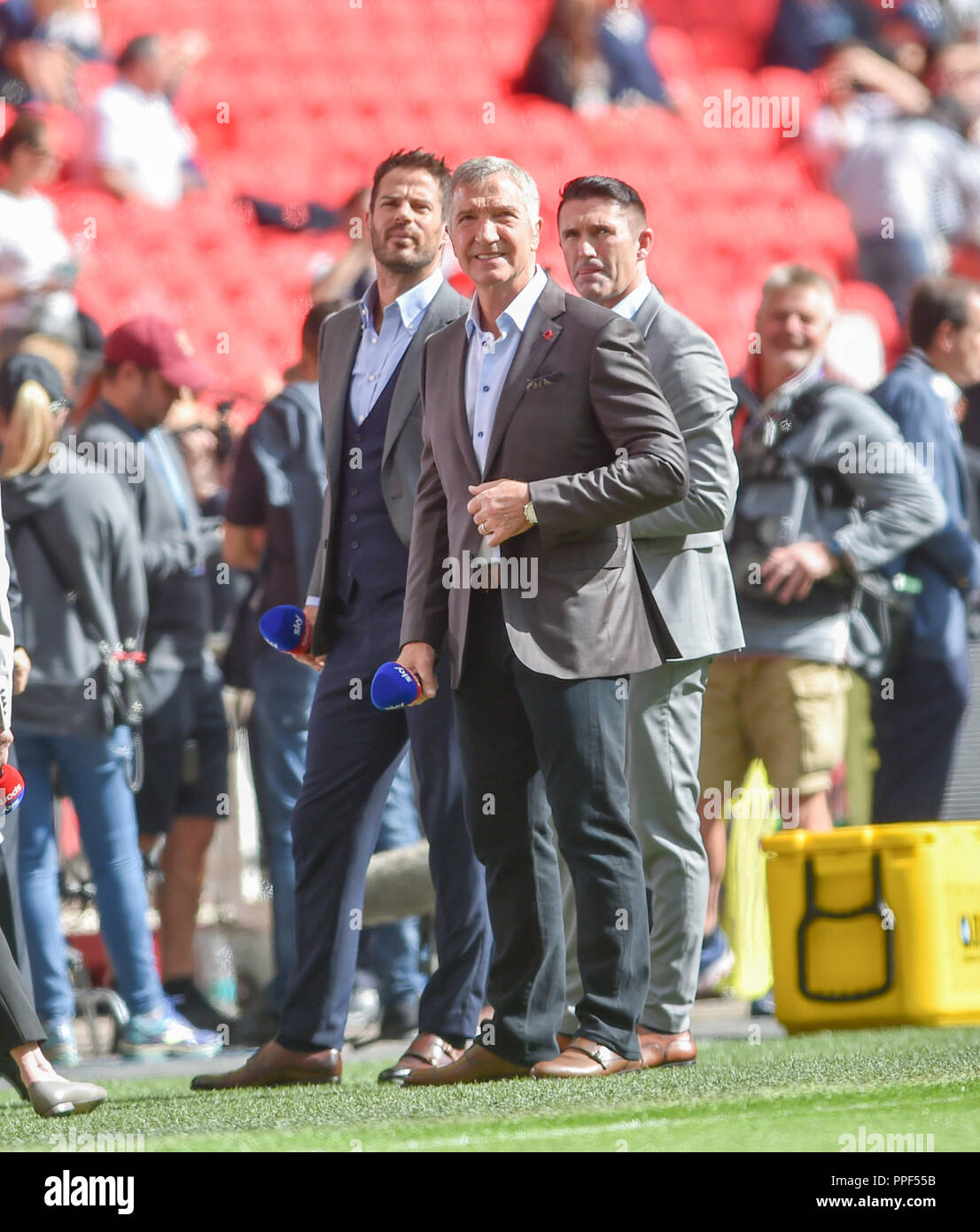 Television pundits and former players Jamie Redknapp , Graeme Souness  and Robbie Keane at the Premier League match between Tottenham Hotspur and Liverpool at Wembley Stadium , London , 15 Sept 2018 Photo Simon Dack / Telephoto Images.  Editorial use only. No merchandising. For Football images FA and Premier League restrictions apply inc. no internet/mobile usage without FAPL license - for details contact Football Dataco Stock Photo