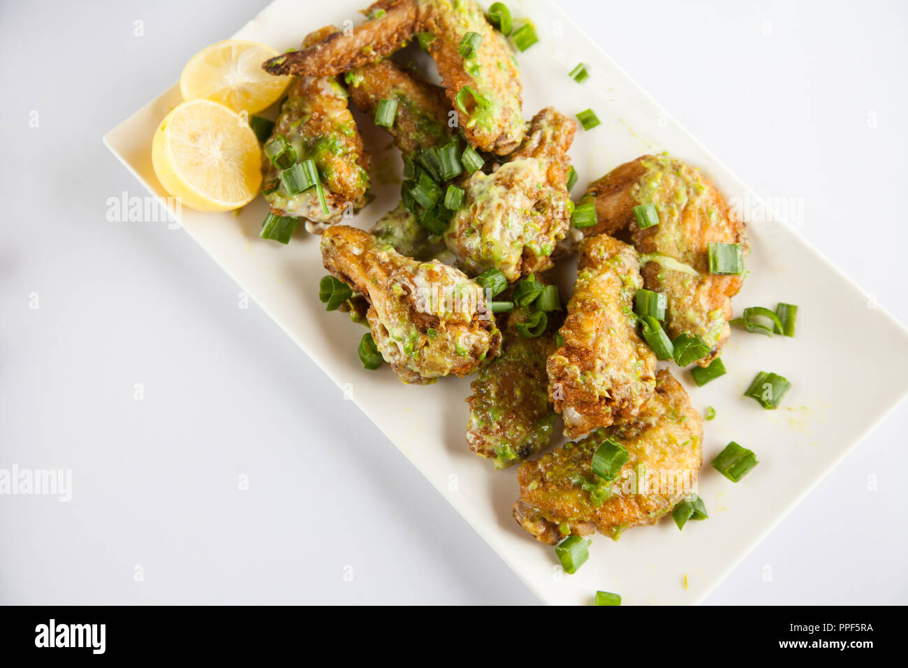 Green Chilli Chicken Wings Stock Photo Alamy
