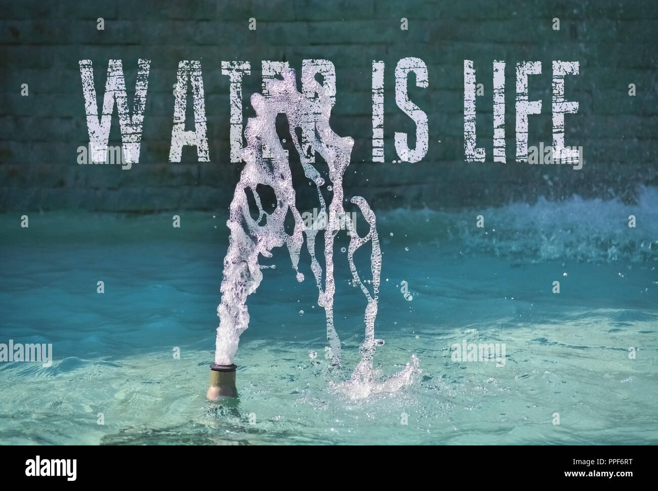 Water fountain and a pool of clean drinkable water with text in the background Stock Photo