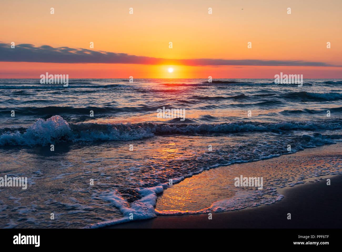 Amazing beautiful sunrise at the sea Stock Photo - Alamy
