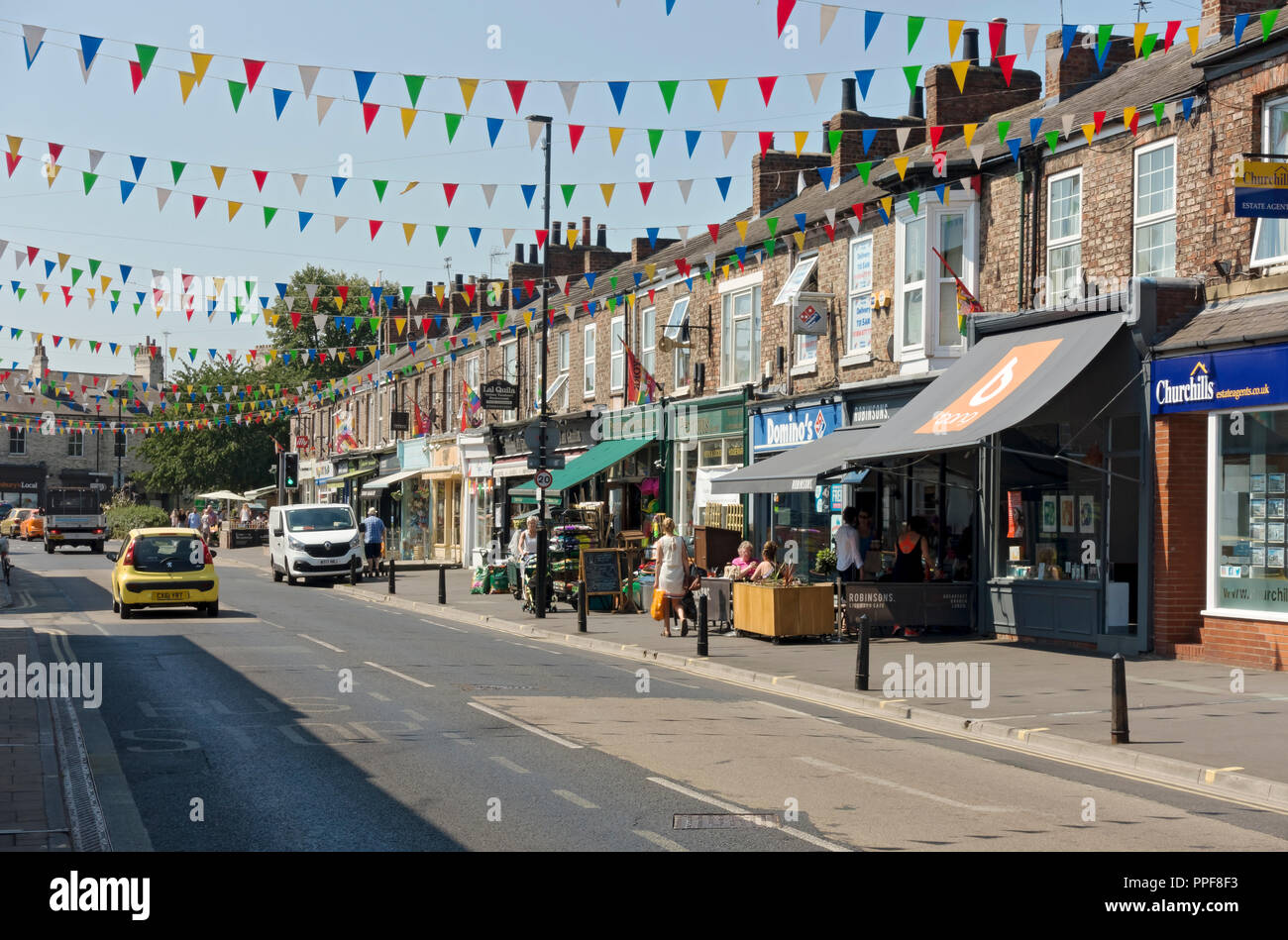 Independent shops stores businesses on Bishopthorpe Road known as Bishy Road in summer York North Yorkshire England UK GB Great Britain Stock Photo