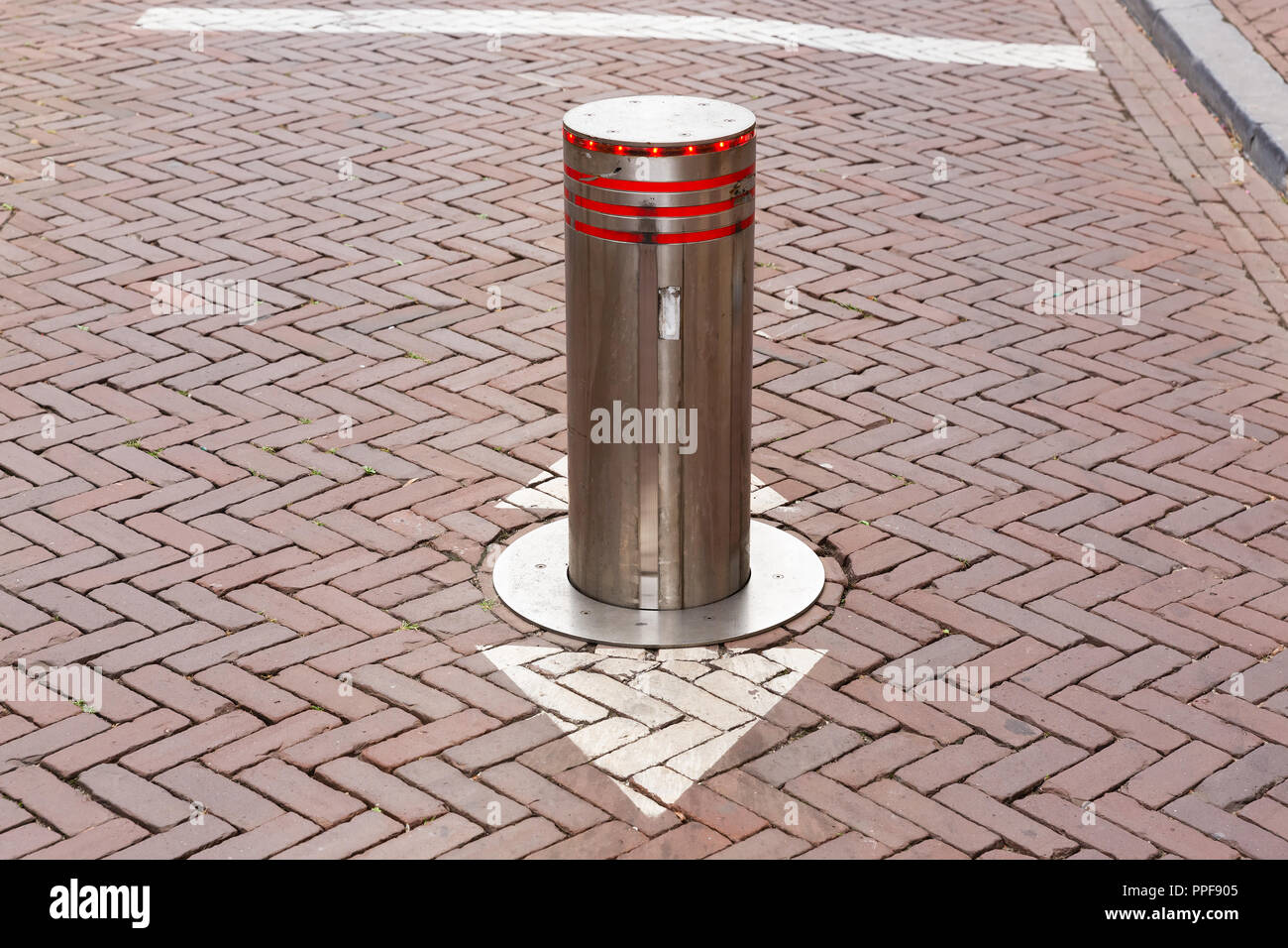 picture of a rising bollard on a street in the Netherlands Stock Photo