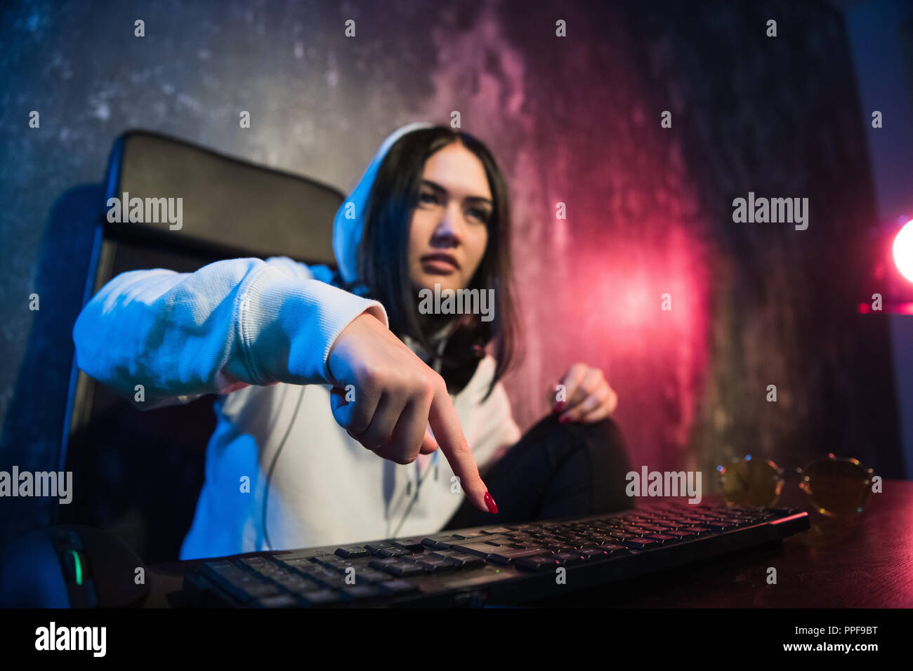 Woman hacker is ready to run malware program virus on the internet. Start hacking remote system computer Stock Photo